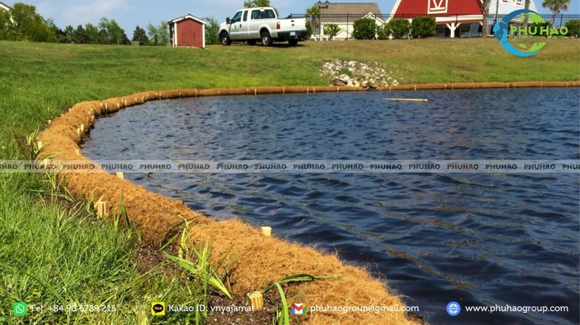 Coir log installation along an ecological revetment shoreline